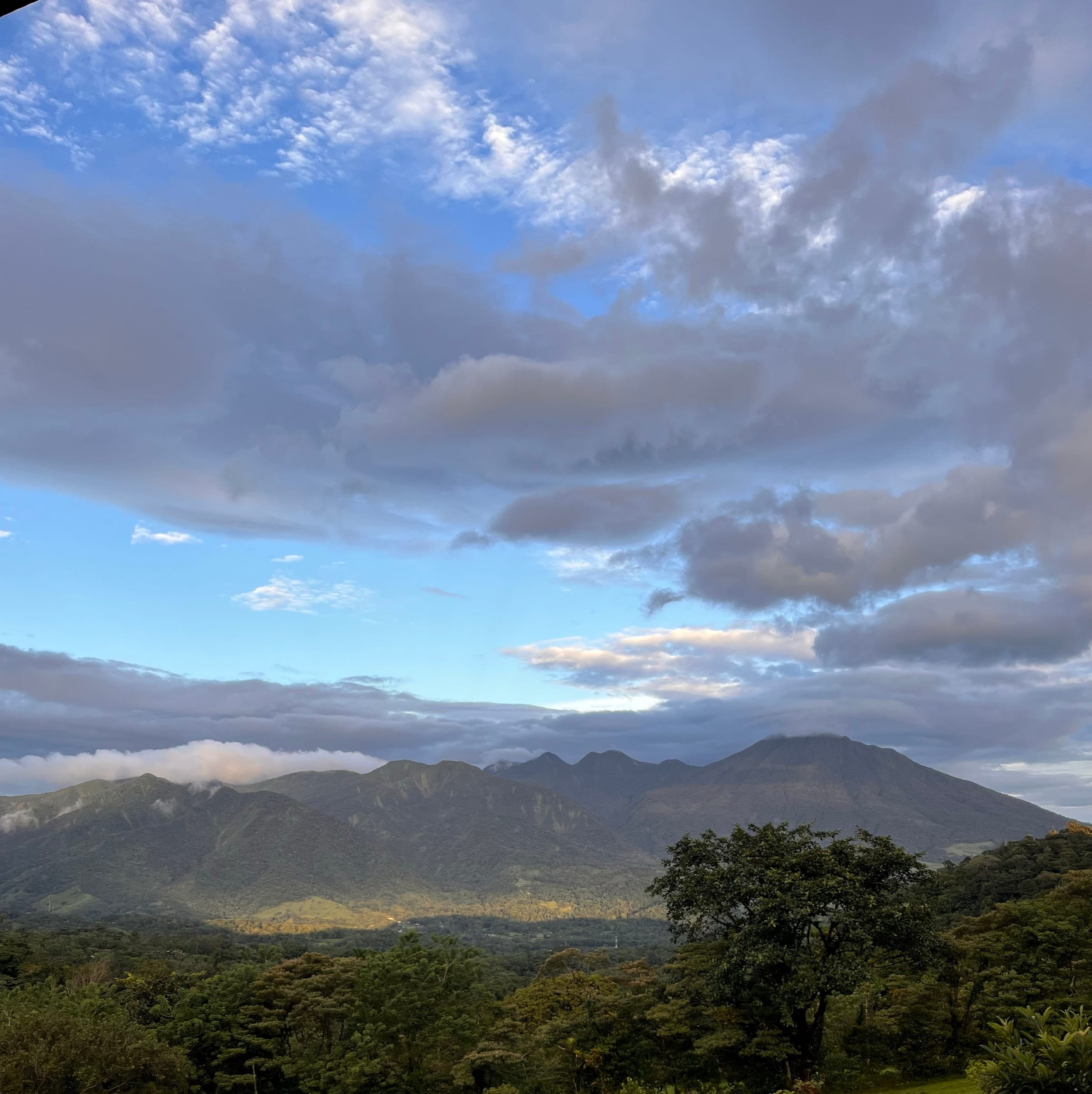 The Tenorio massif at dawn, cloud caught along the ridgeline